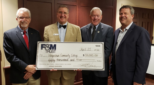 Representatives from OFAC Visual Credit Union and Hagerstown Community College pose for a photo with the $50,000 donation from OFAC Visual Credit Union